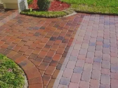 A brick walkway with a red brick pattern.